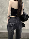 Gothic Flared Jeans mit Schleifen und Raw Edge Saum